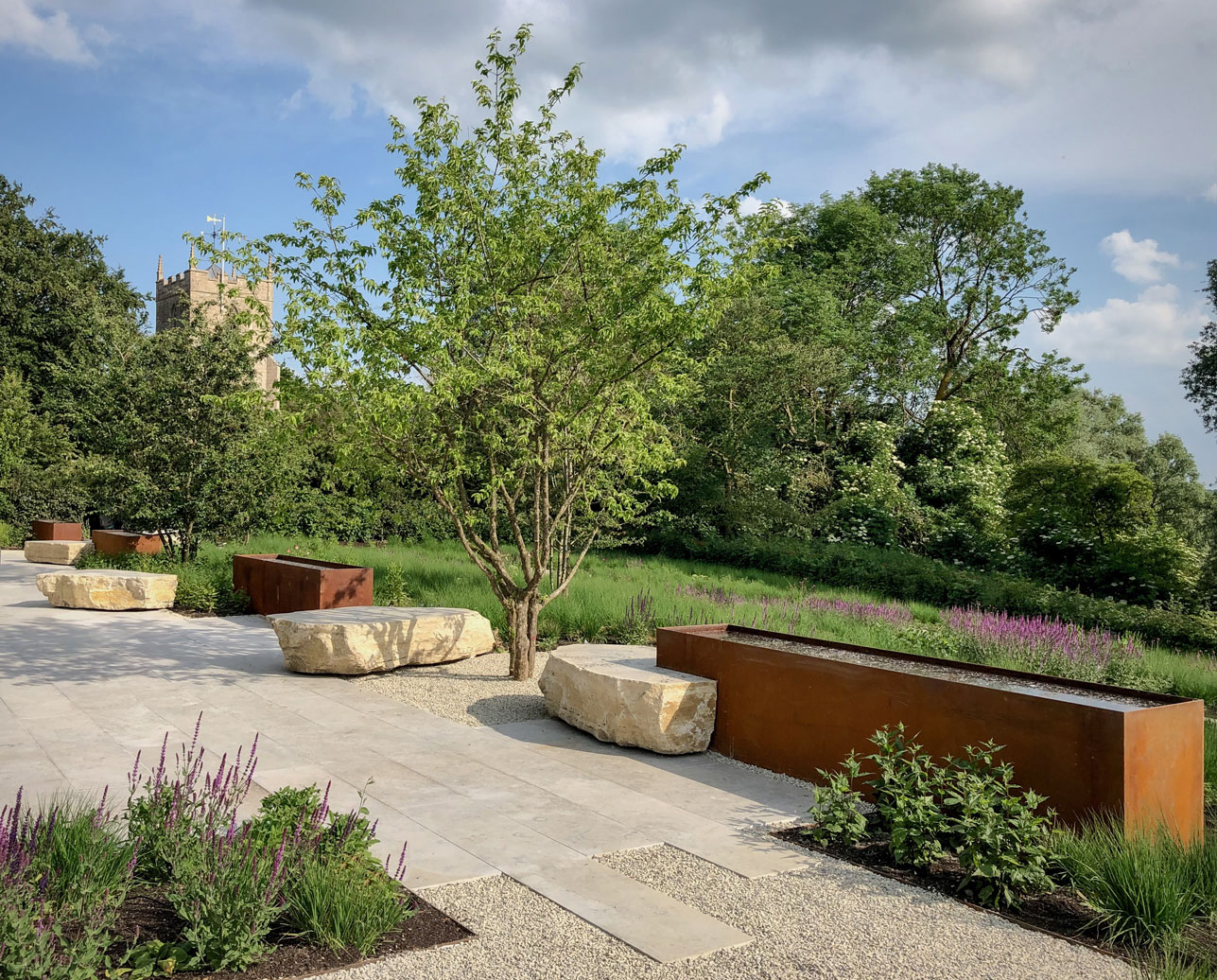 Colm Joseph Cambridgeshire modern garden design and contemporary landscape design with water feature of corten steel and limestone paving & boulders 