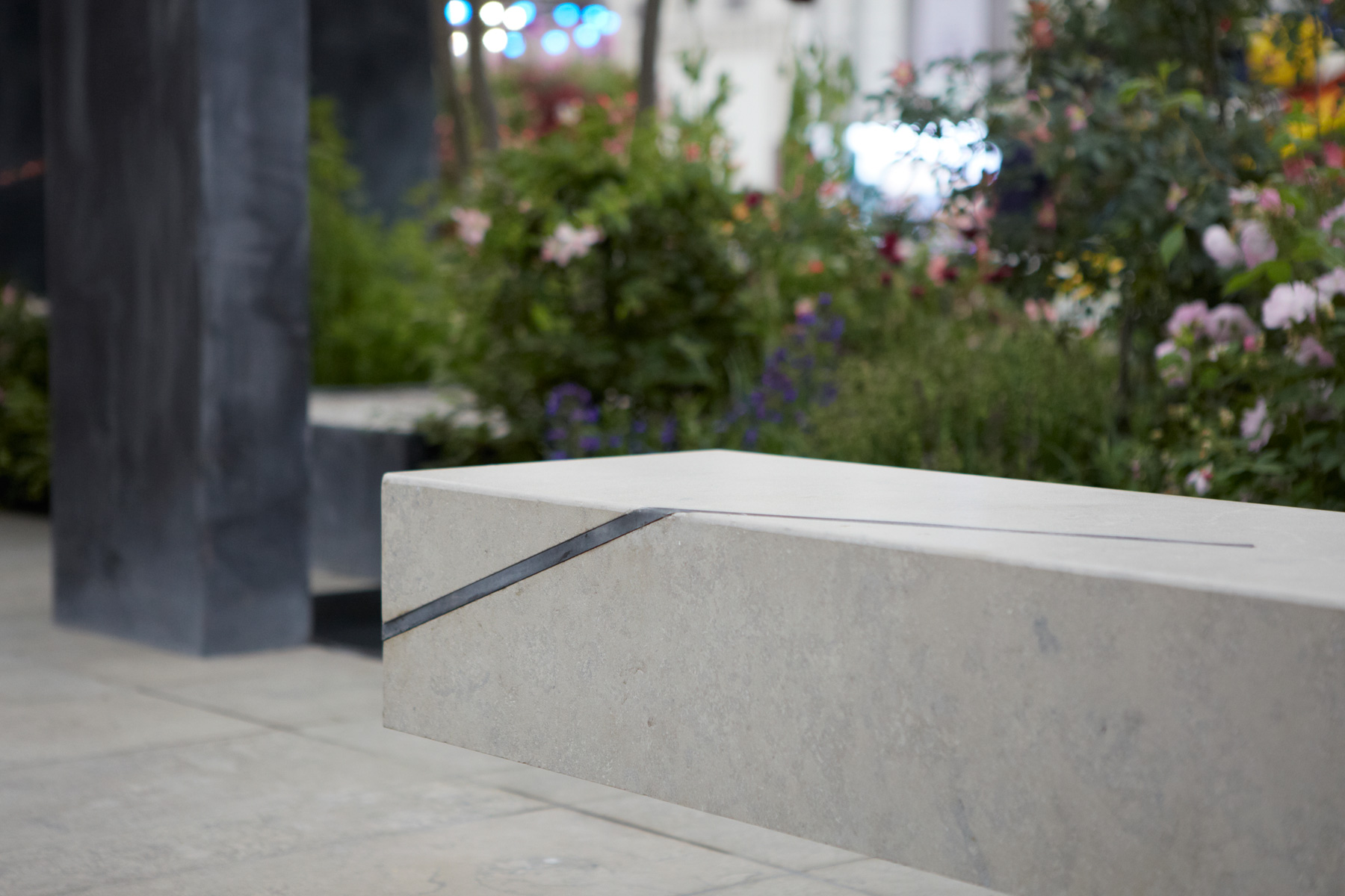 Colm Joseph Gardens - RHS Chelsea Flower Show cantilevered limestone seat and steel inlay detail