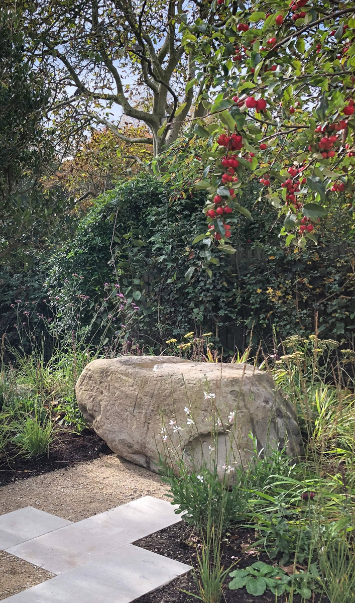 Colm Joseph Gardens   Cambridge garden design naturalistic planting boulder seat.
