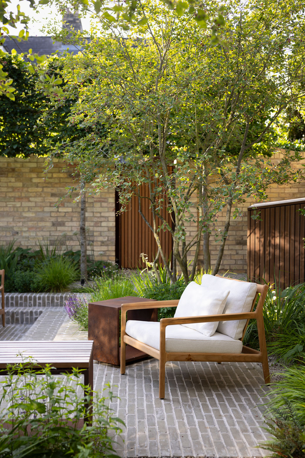 Colm Joseph Cambridge courtyard garden design seating area clay pavers natural planting