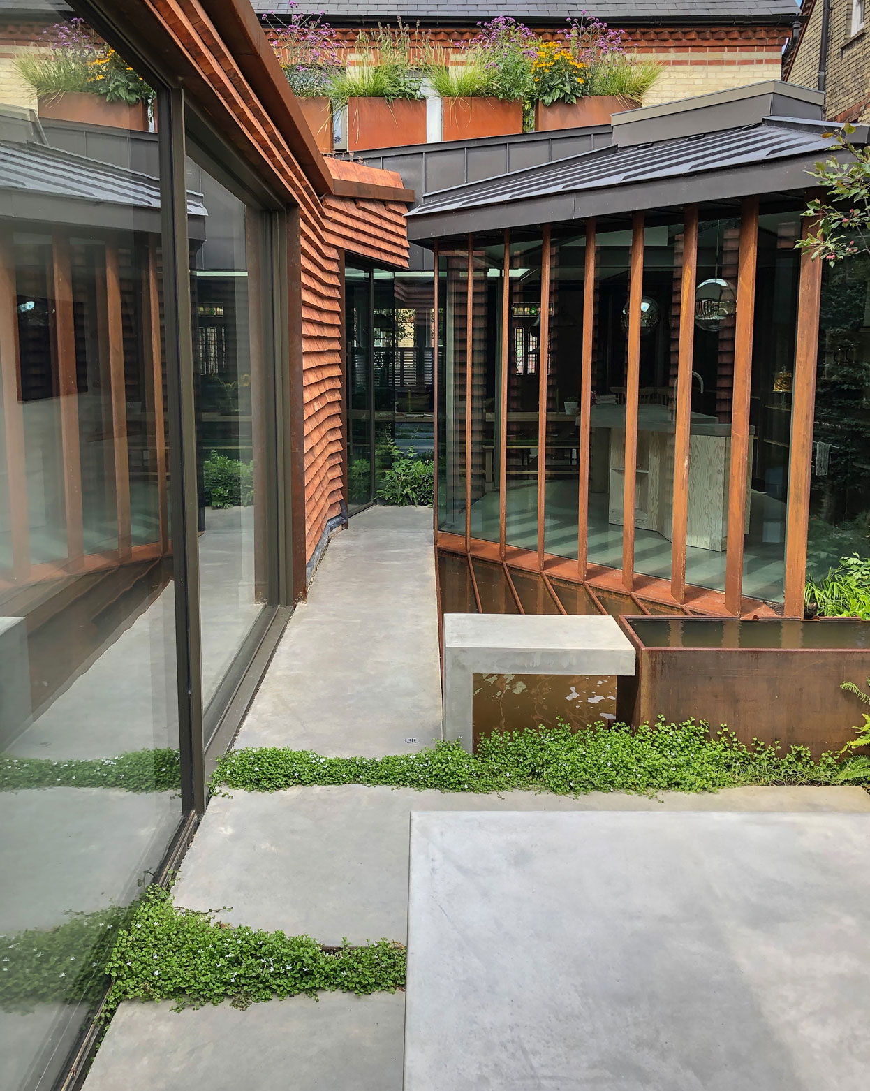 Colm Joseph Cambridge modern house garden design concrete paving corten steel water feature