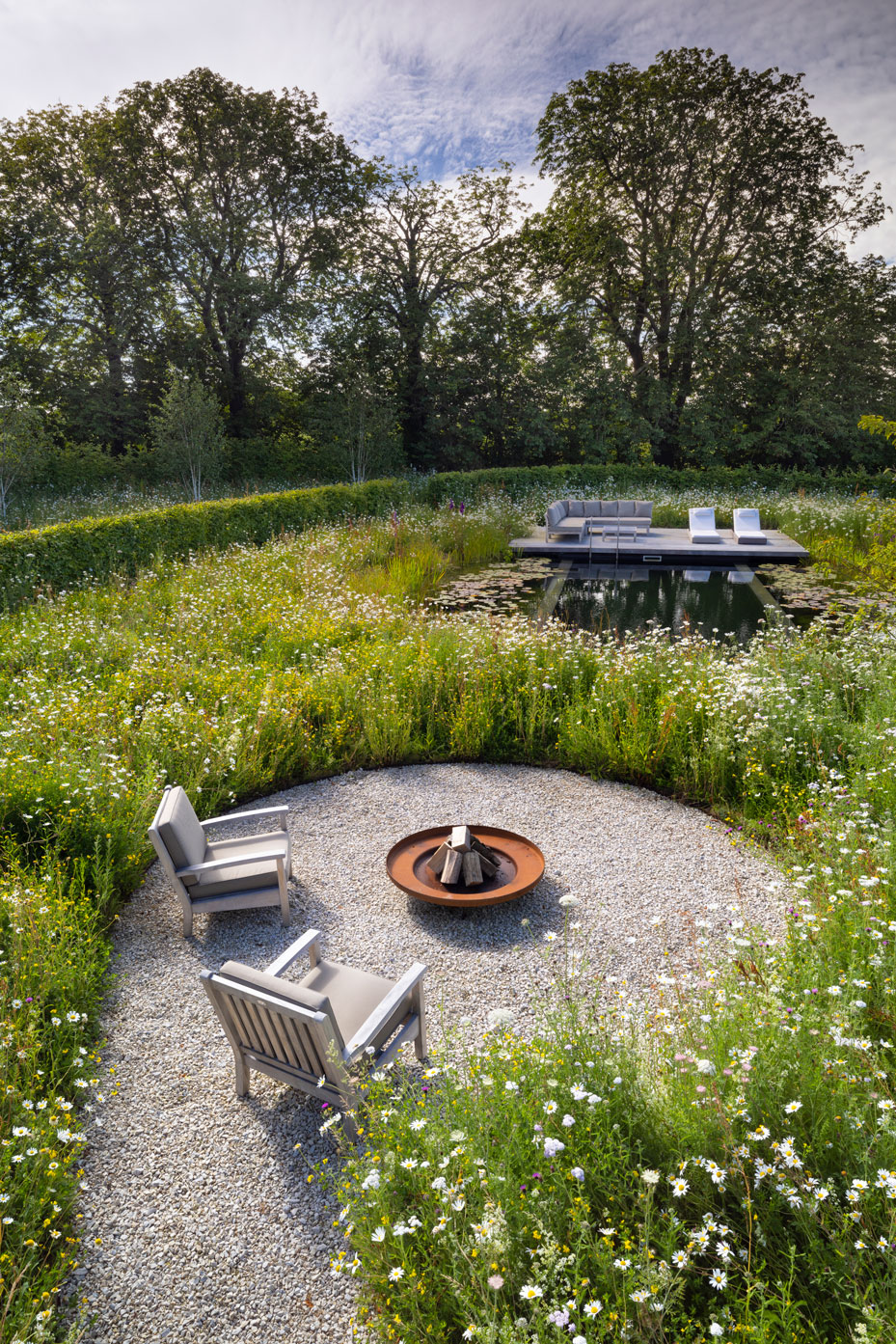 Colm Joseph Cambridgeshire country garden overhead view circular seating area fire bowl natural swimming pond wildflower meadow hornbeam hedging