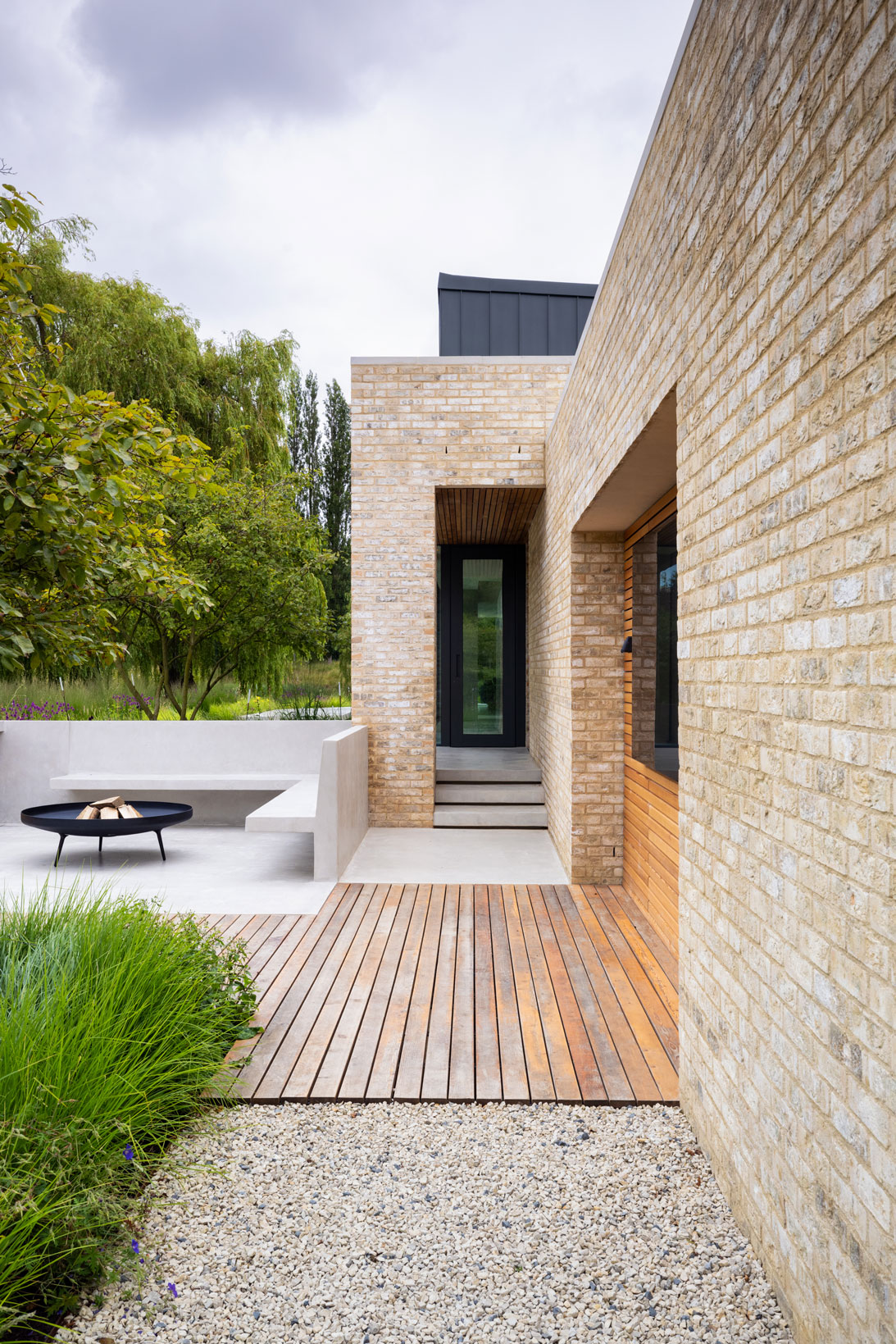 Colm Joseph modern country garden cambridgeshire bespoke outdoor seating concrete cantilevered bench floating steps shadow gap timber deck natural planting