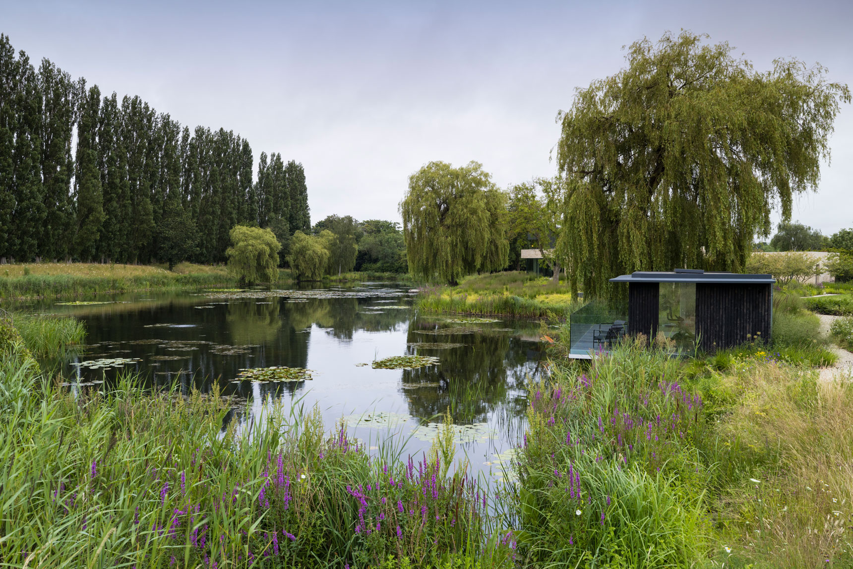 Colm Joseph modern country garden cambridgeshire lake view contemporary home office garden room cantilevered seating deck