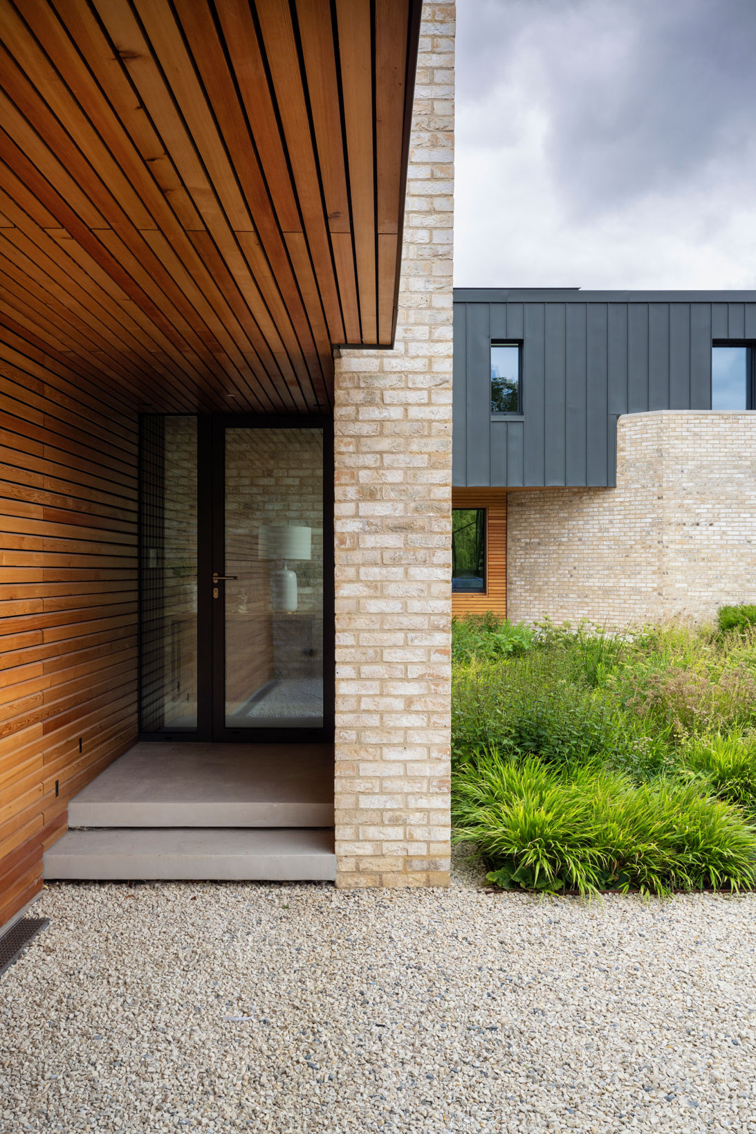 Colm Joseph modern country garden house cambridgeshire naturalistic planting design floating concrete steps limestone gravel